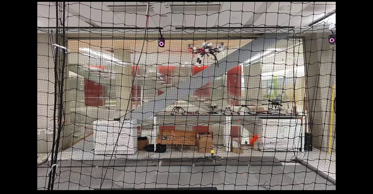 Photograph from the FDCL announcement: Quadrotor Payload Transportation Demonstrated in Flight