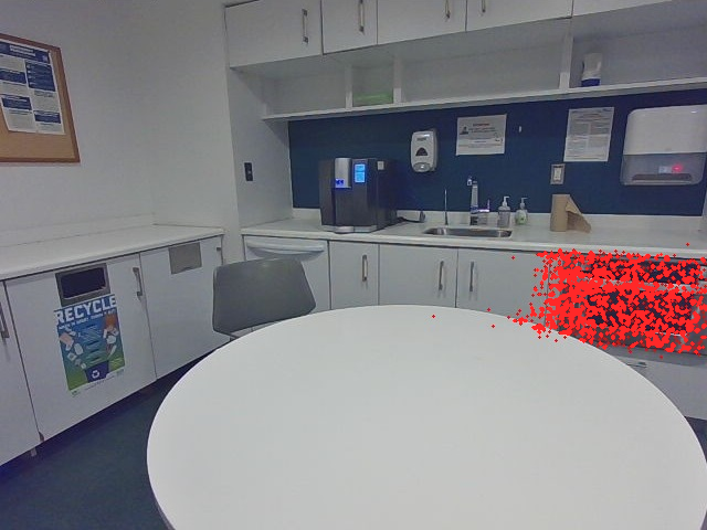 Camera view of an office kitchen with the best match to the query where to heat up food highlighted in red.