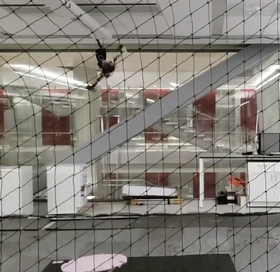 Quadrotor backflip in wind: a frame from the lab’s flight demonstration.